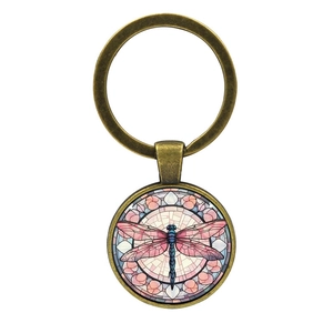 Vintage bronze dragonfly keychain with colorful mosaic wing art in a round glass pendant