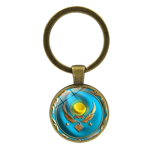 Porte-clés métal emblème Kazakhstan avec cadre en bronze vintage et cabochon en verre
