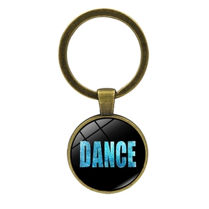 Dettaglio portachiavi in bronzo con testo Dance glitterato blu in ciondolo di vetro tondo