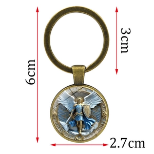 Vintage bronze Archangel Michael glass gem keychain with detailed armor and sword wings