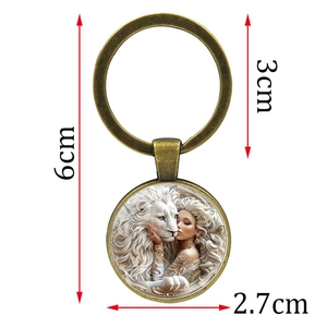 Porte-clés cabochon en verre lion et femme, finition bronze vintage, longueur totale 6cm