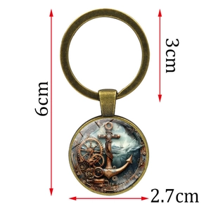 Vintage steampunk nautical anchor keychain with bronze finish and glass cabochon pendant