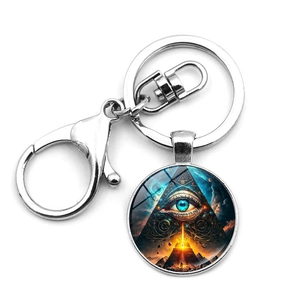 Macro detail of Eye of Providence glass dome pendant on a silver metal keychain