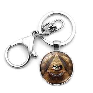 Detailed close-up of Eye of Horus keychain with silver metal lobster clasp and pyramid art