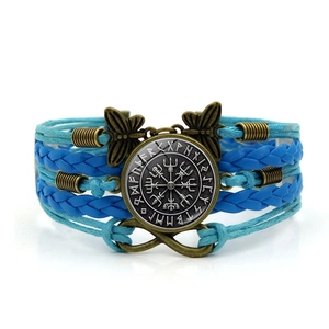 Detail of Viking compass charm with blue braided cords and infinity metal ornaments