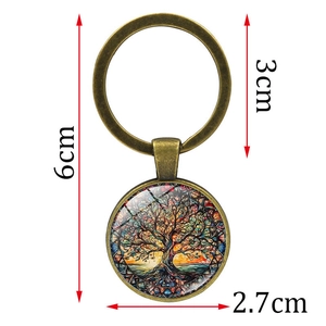 Vintage Tree of Life keychain with bronze finish and colorful glass pendant on white background