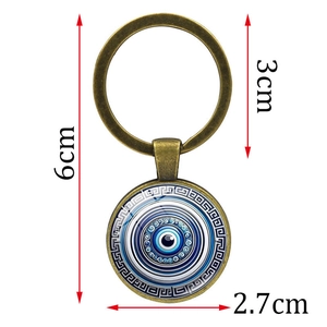 Retro bronze blue evil eye keychain with measurements of length and pendant diameter