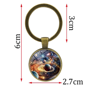 Vintage bronze galaxy keychain with celestial planet pendant and glass dome showing dimensions
