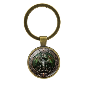 Retro bronze keychain featuring a green pterodactyl dragon glass gem pendant for bags