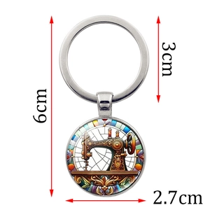 Vintage sewing machine keychain with artistic stained glass pattern and silver metal ring