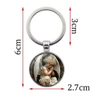 Silver metal keychain with a guardian angel boy pendant and dimensions markers