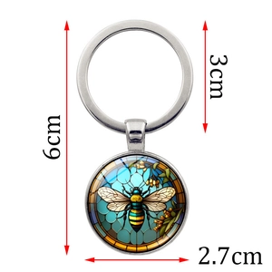 Detailed view of bee pattern keychain with dimensions 6cm length and 2.7cm pendant size