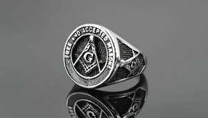 Macro detail of men's Masonic ring in antique silver finish with Free and Accepted Masons text