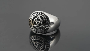 Detailed view of Viking signet ring with Celtic Triquetra and Nordic Runes engraving