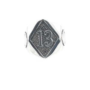 Vintage stainless steel ring featuring a rustic number 13 on a diamond-shaped face