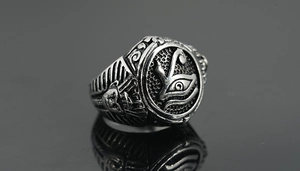 Macro view of vintage titanium steel ring with Eye of Horus and Egyptian pharaoh details