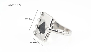 Macro detail of skeleton hand holding Ace of Spades ring with dimensions and weight