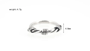 Detail view of woven titanium steel ring with 4.8mm width and vintage finish