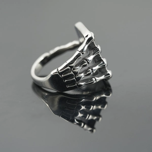 Gothic skull hand bone ring in titanium steel with a polished mirror finish for men