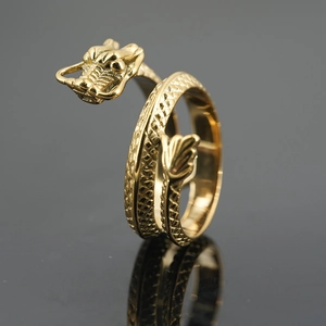 Vintage golden dragon wrap ring in punk style with detailed scales and dragon head