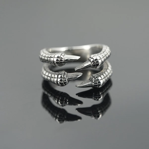 Gothic dragon claw ring in polished silver steel with intricate scale textures