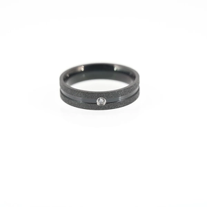 Matte black titanium steel ring with polished groove and a single white zircon inlay