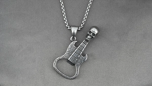 Detail of vintage guitar pendant with skull head and functional bottle opener feature