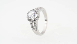 Macro view of a round halo engagement ring with a split-shank band and shimmering stones