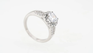 Detailed view of silver titanium halo ring with split shank and pave-set diamonds