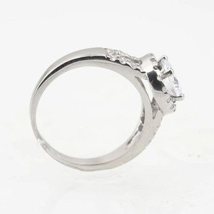 Classic silver-toned titanium steel ring with large round solitaire and pave setting