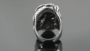 Macro detail of gothic skull ring showing inner texture and polished stainless steel finish