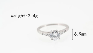Detail view of titanium steel ring with 6.9mm center stone and side pave diamonds
