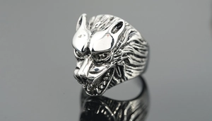 Macro shot of detailed punk wolf head ring with vintage silver finish and sharp textures