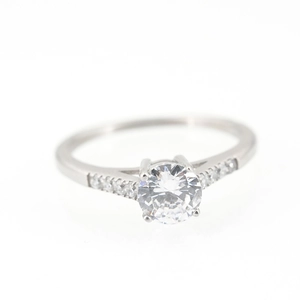 Titanium steel engagement ring with round center stone and side accents on white background