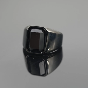 Polished black rectangular gemstone ring with a minimalist stainless steel band for men