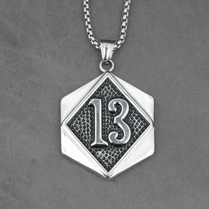 Hip hop titanium steel shield necklace featuring number 13 relief on a black textured background