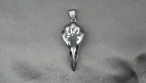 Detail of Viking bird skull pendant with Vegvisir compass engraving in gothic punk style
