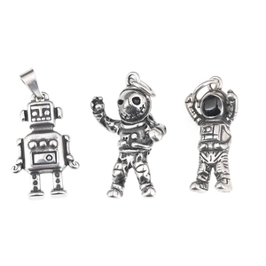 Three vintage stainless steel astronaut pendants with steampunk black oxidized finish details