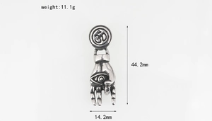 Macro shot of stainless steel evil eye hand pendant with weight and size measurements
