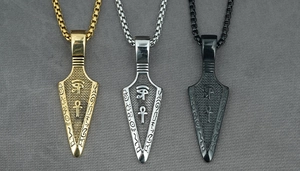 Detailed view of Egyptian arrow necklaces in gold, silver, and black finishes