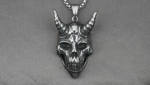 Detailed macro view of vintage titanium steel skull pendant with gothic ram horns