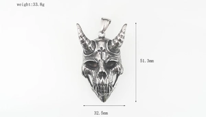 Macro view of silver skull pendant with dimensions 51.3mm by 32.5mm and weight 33.8g