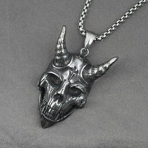 Gothic titanium steel devil skull necklace with ram horns and cross detail on gray texture