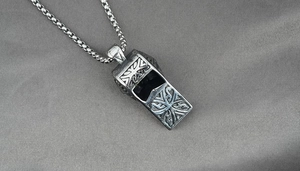 Detail of cross-patterned whistle pendant necklace with durable square box chain