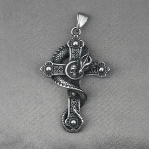 Gothic dragon serpent wrapped around a vintage silver steel cross necklace with skull detail