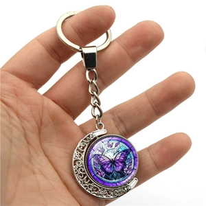 Porte-clés lune rotatif en argent avec pendentif papillon violet sous verre