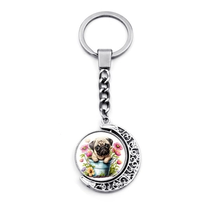 Porte-clés lune rotatif avec illustration de carlin et fleurs en métal argenté