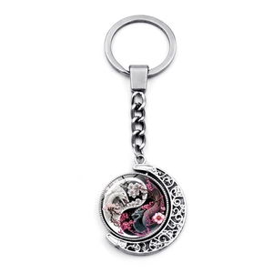 Yin Yang Dragon Moon Keychain with rotating glass cabochon pendant in silver finish
