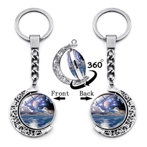 Rotating double-sided starry sky moon keychain with 360-degree spinning galaxy pendant