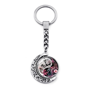 Rotating Yin Yang Dragon moon pendant keychain with antique silver hollow design